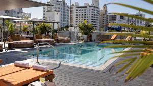 a swimming pool on top of a building at Uma House by Yurbban South Beach in Miami Beach