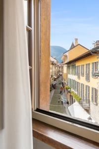 a view from a window of a city street at Hotel Pironi in Cannobio