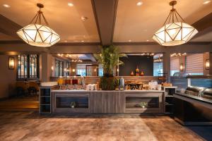 a bar in a restaurant with two lights at The Gleneagle Hotel & Apartments in Killarney