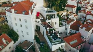 an aerial view of a city with white buildings at Memmo Alfama - Design Hotels in Lisbon