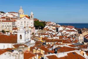 a view of a city with red roofs at Memmo Alfama - Design Hotels in Lisbon