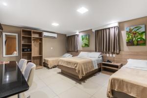 Una cama o camas en una habitación de NovoHotell Recife