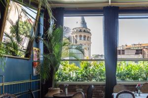 a view of the leaning tower from a restaurant window at Meroddi Barnathan Hotel in Istanbul