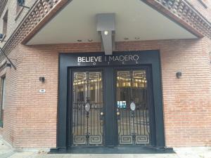 a brick building with two doors in front of it at Believe Madero Hotel in Buenos Aires