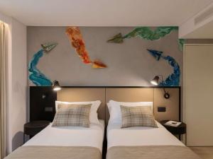 เตียงในห้องที่ ibis Styles Lisboa Aeroporto