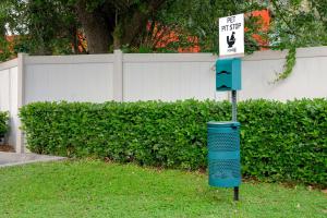 a blue trash can with a sign on top of it at Home2 Suites By Hilton Gainesville in Gainesville