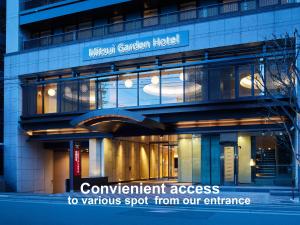 a building with a sign that reads convenient access to various spot from our entrance at Mitsui Garden Hotel Kyoto Shijo in Kyoto