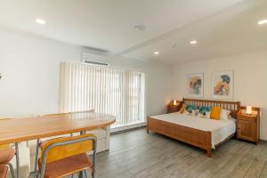 a bedroom with a bed and a table in it at Hotel The Cathedral Vegueta in Las Palmas de Gran Canaria