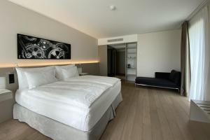 מיטה או מיטות בחדר ב-Modern Times Hotel, Vevey, A Tribute Portfolio Hotel