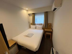 Tempat tidur dalam kamar di Hotel Passage 2