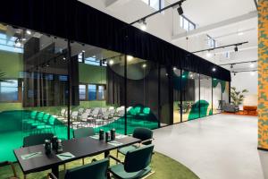 a dining room with a table and chairs at CX Milan Bicocca in Milan