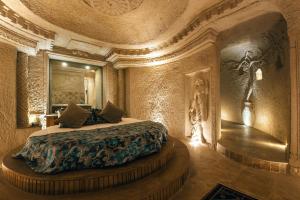 Kama o mga kama sa kuwarto sa Harem Suites Cappadocia