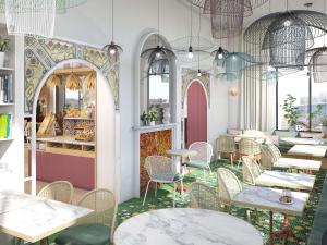 a restaurant with tables and chairs in a room at Ibis Styles Strasbourg Centre République in Strasbourg