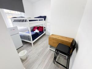 Voodi või voodid majutusasutuse Willesden Green Budget Guesthouse toas