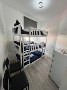 Voodi või voodid majutusasutuse Willesden Green Budget Guesthouse toas