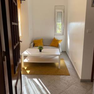 a living room with a couch and a table at Lisbon Airport Guesthouse in Lisbon