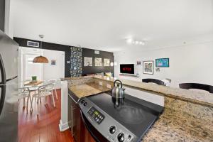 a kitchen with a stove and a counter top at South Beach Family & Pet Friendly with Free Parking in Miami Beach