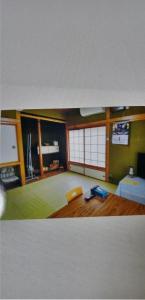 A bed or beds in a room at Minpaku Suzuki