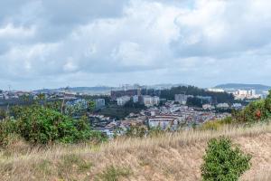 a view of a city from the top of a hill at MyPlaceLisbon - Lumiar Luxury House in Lisbon