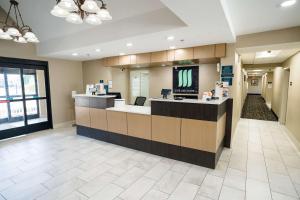 a lobby of a hospital with a tv on a counter at MainStay Suites Knoxville Airport in Alcoa