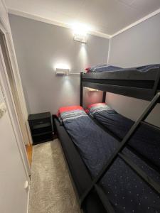 a bedroom with two bunk beds in a room at Comfortable Villa In Lillehammer in Lillehammer