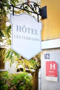 a sign for a hotel les terrazas on a building at Hotel Les Terrasses in Annecy