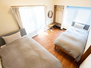 Postel nebo postele na pokoji v ubytování WE HOME STAY Kamakura, Yuigahama - Vacation STAY 67101v