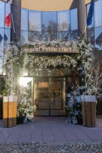 a front of a building with a sign on it at Hotel & Spa REGENT PETITE FRANCE in Strasbourg