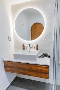 a bathroom with a sink and a mirror at Casa Castillo in Mexico City