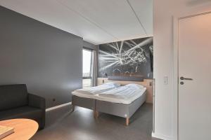 Giường trong phòng chung tại Zleep Hotel Copenhagen Arena