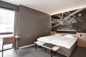 Giường trong phòng chung tại Zleep Hotel Copenhagen Arena