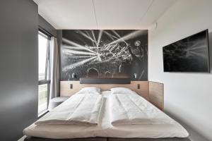 Giường trong phòng chung tại Zleep Hotel Copenhagen Arena