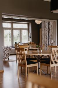 a dining room with a table and chairs at Vassbo Vandrarhem in Falun