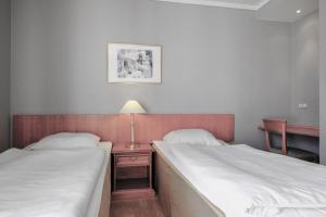 Säng eller sängar i ett rum på Zleep Hotel Prindsen Roskilde