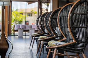 a row of chairs lined up in a row at AC Hotel by Marriott Maui Wailea in Wailea