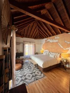 a bedroom with a bed and a map on the wall at Gar Anat Hotel Boutique in Granada