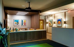 a lobby with a reception desk and a couch at Lotus Honolulu at Diamond Head in Honolulu