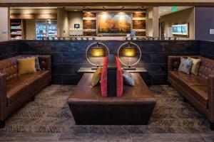 a waiting room with two couches and a table at SpringHill Suites by Marriott Springdale Zion National Park in Springdale