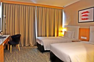 Cama ou camas em um quarto em Holiday Villa Johor Bahru City Centre