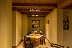 a dining room with a table and chairs in it at Albergo della Posta in Taverna