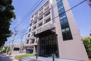 a rendering of the front of the building at The Journey Hotel Laksi in Bangkok