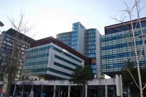 a tall building with many windows in a city at VIP Executive Arts Hotel in Lisbon