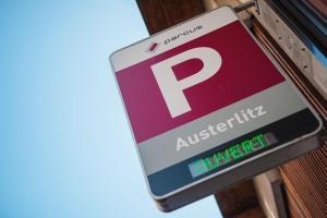 a parking sign for an australium sign on a building at Hotel Beaucour in Strasbourg