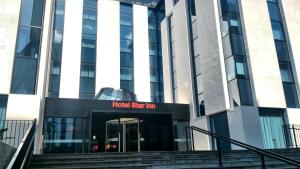 a hotel sign in front of a building at Star inn Lisbon Airport in Lisbon