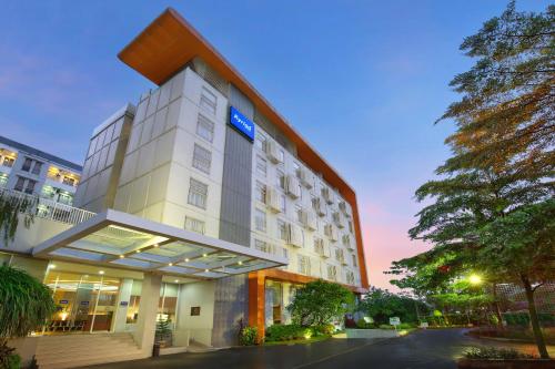 a rendering of a hotel at dusk at Kyriad Hotel Airport Jakarta in Tangerang