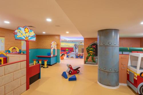 a childrens play room with a toy car and a fire hydrant at U Magic Palace in Eilat