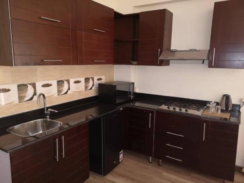 Una cocina o kitchenette en Cordoba Suites