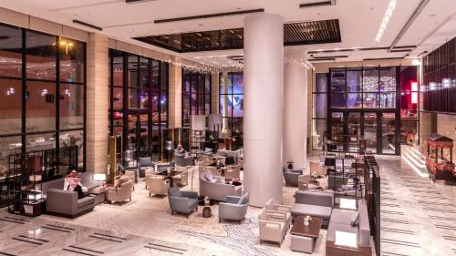 a lobby with couches and chairs in a building at Braira Al Nakheel in Riyadh