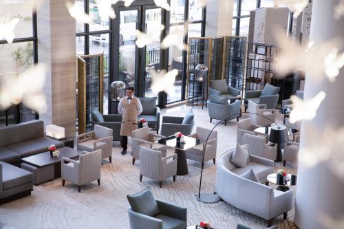 a man is standing in the lobby of a building at Braira Al Nakheel in Riyadh