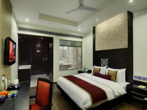 Gulta vai gultas numurā naktsmītnē Hotel Godwin Deluxe -Near New Delhi Railway Station - Paharganj